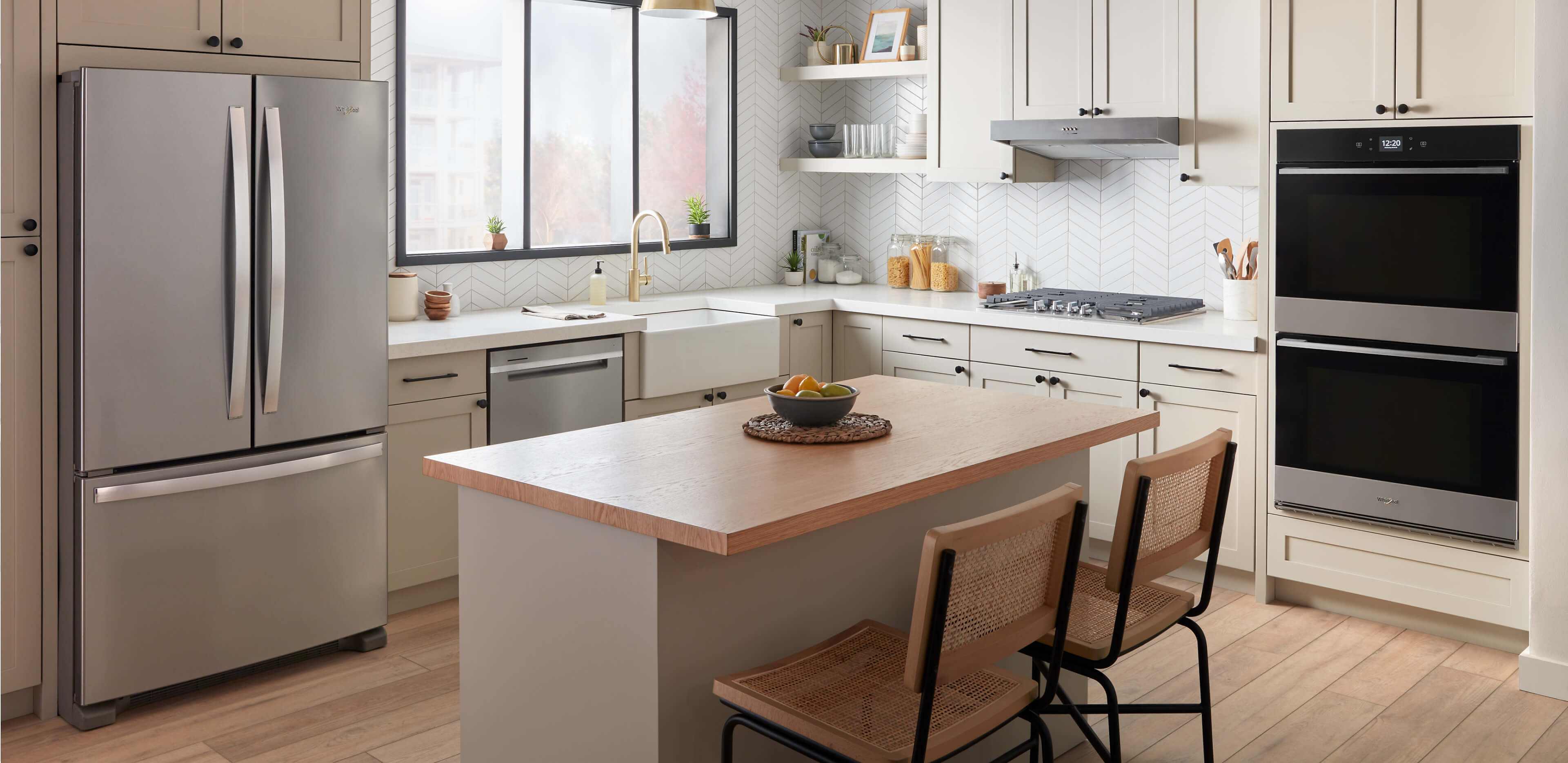 A light colored kitchen featuring Whirlpool® Appliances