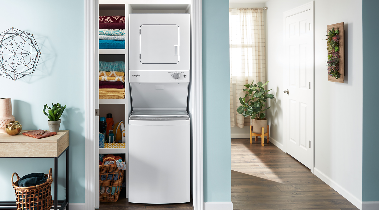 A Whirlpool® stacked washer and dryer in a closet
