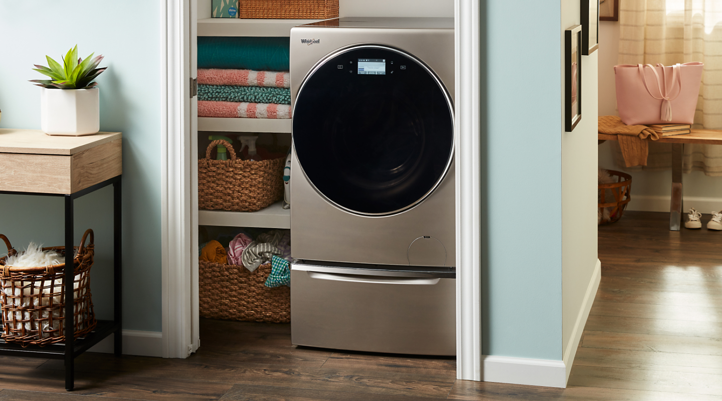 A Whirlpool® all-in-one washer and dryer in a closet