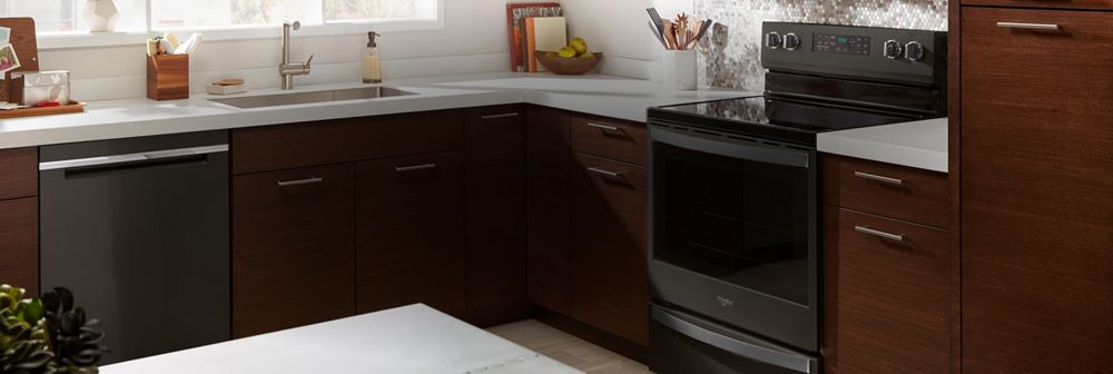 A kitchen with a Whirlpool® range.