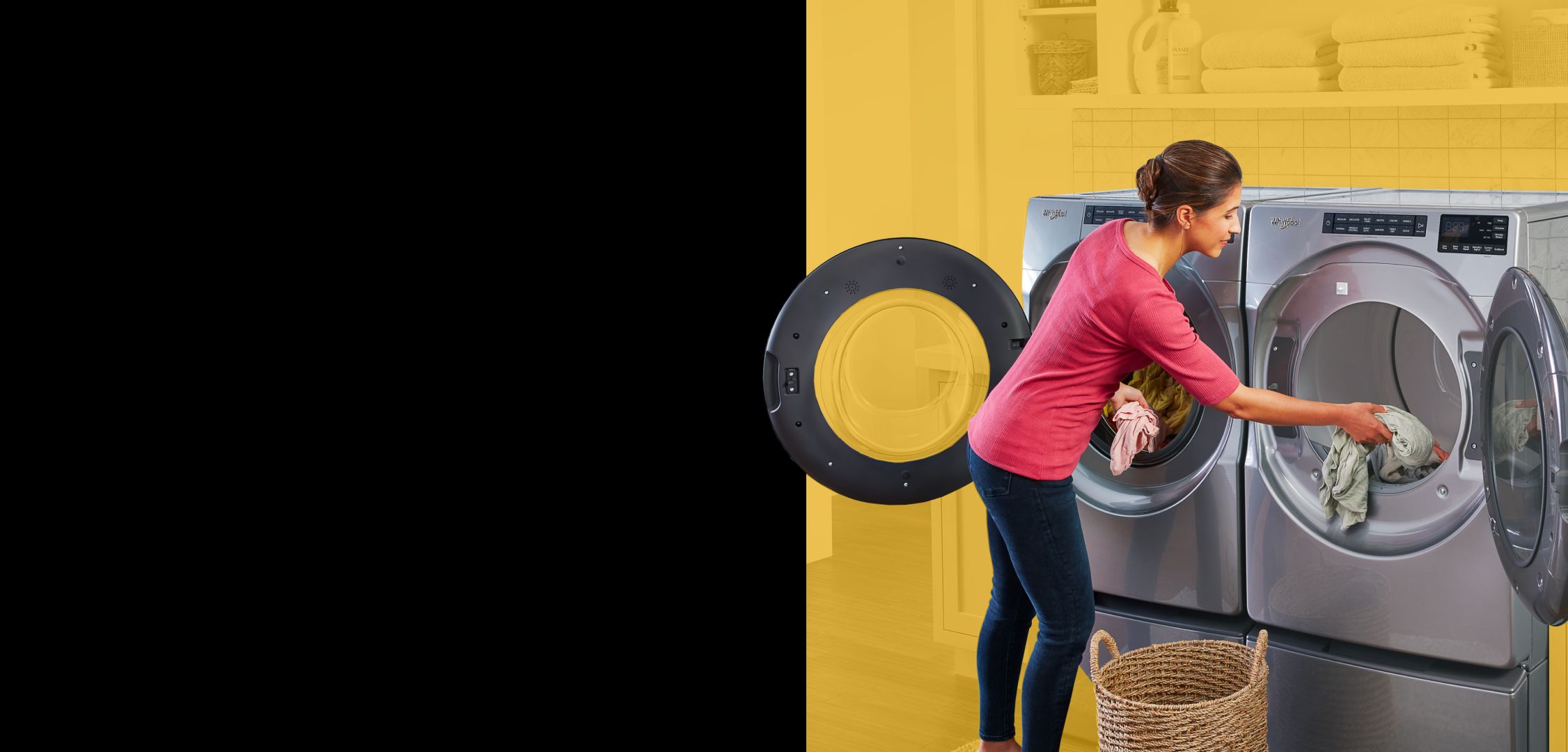 Woman unloading Whirlpool® washer and loading Whirlpool® dryer.