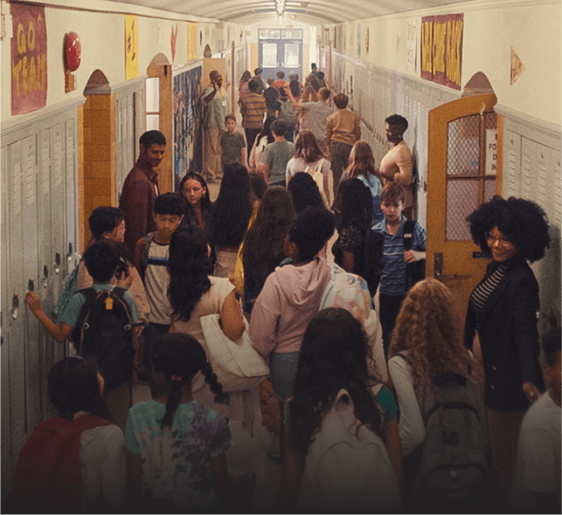 Kids and teachers filling up a school hallway