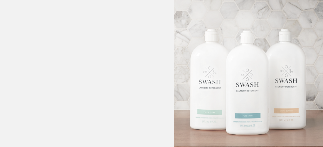Three bottles of Swash® laundry detergent.