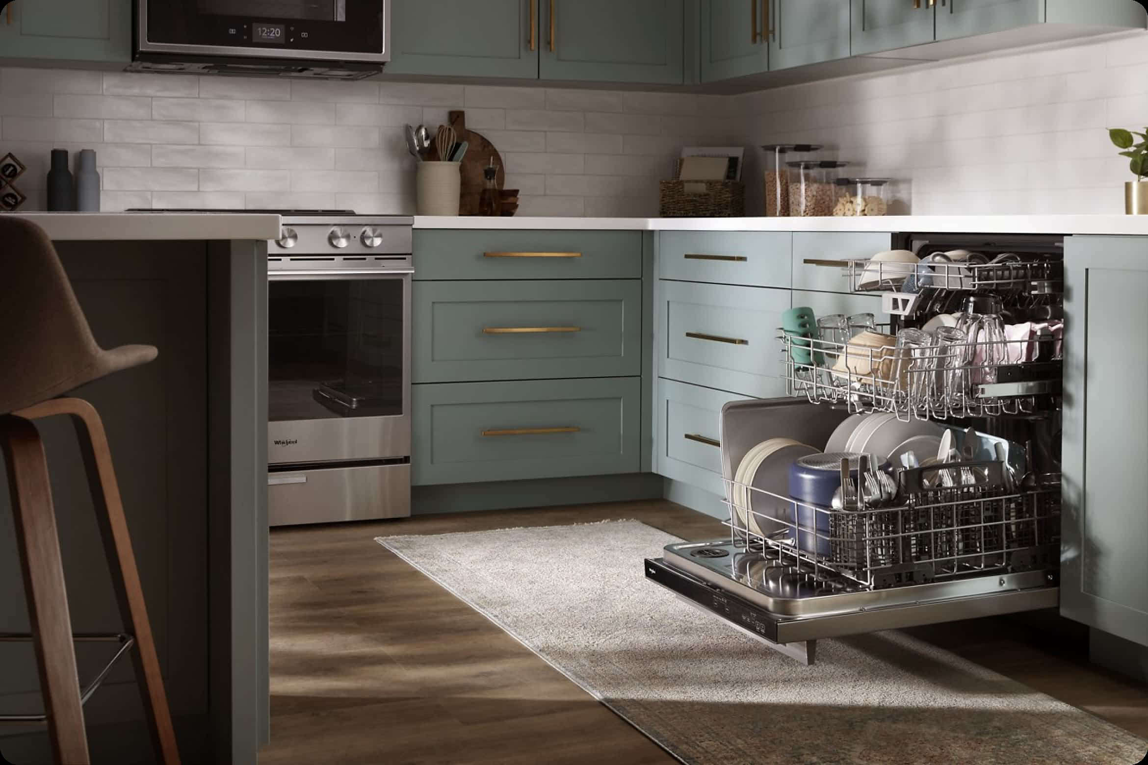 An open Whirlpool® Dishwasher in a clean, modern kitchen