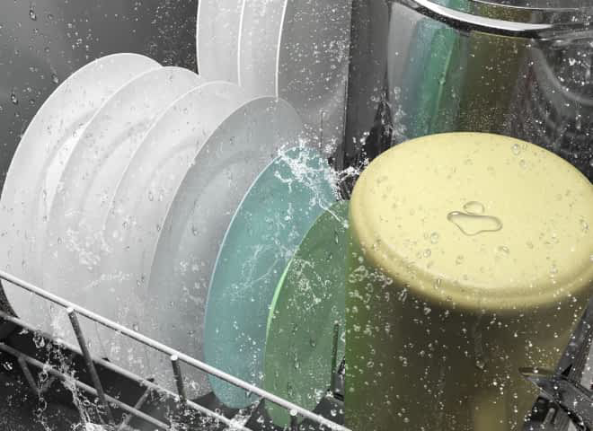 Water spraying plates and pots in a dishwasher