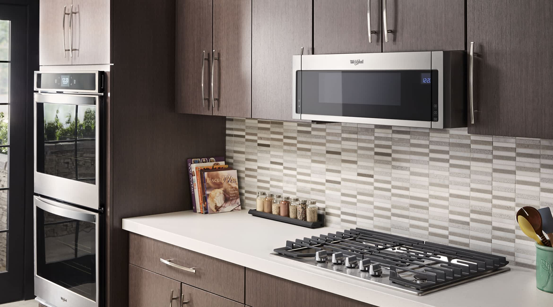 A Whirlpool® Low Profile Over-the-Range Microwave in a kitchen
