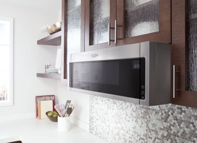A Whirlpool® Low Profile Over-The-Range Microwave in a modern kitchen