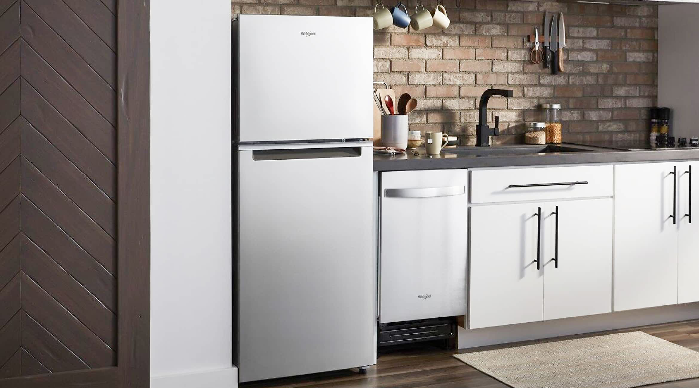 A Whirlpool® Top Freezer Refrigerator in a city kitchen