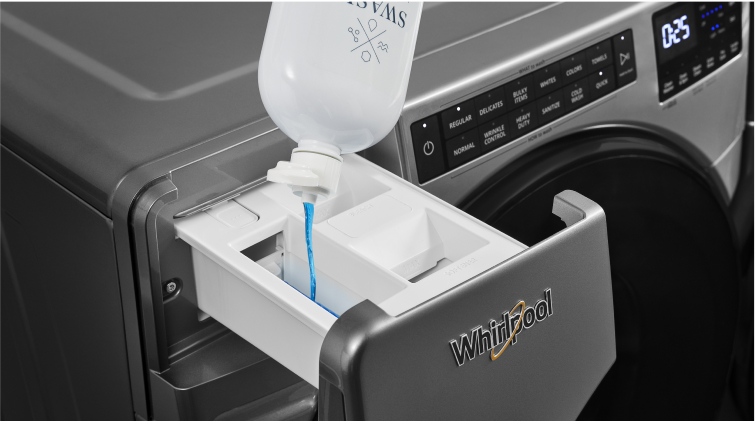 Laundry detergent is poured into a Whirlpool® Washer with a Load & Go™ Dispenser