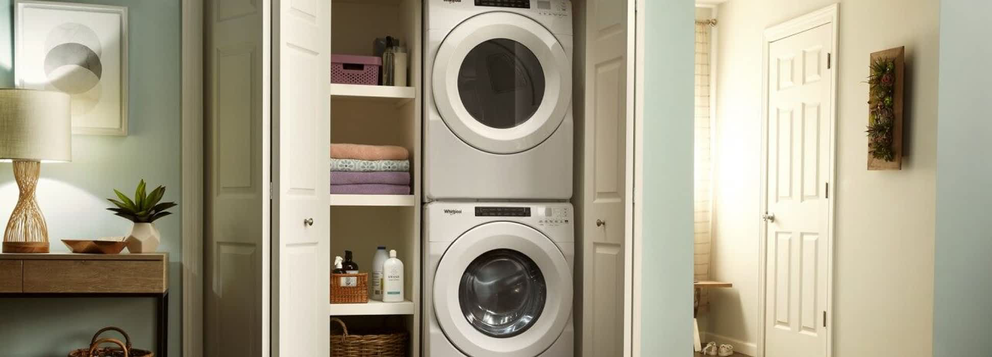 A Whirlpool® Stacked Laundry Center in a closet