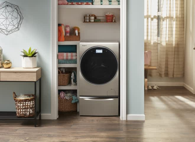 A Whirlpool® All-in-One Washer & Dryer installed in a closet