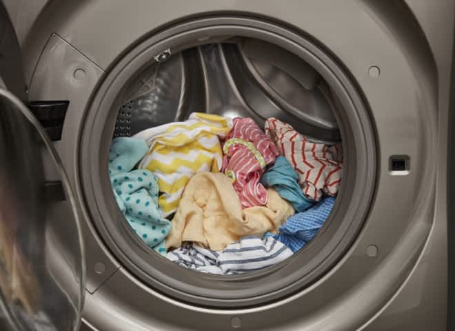 Colorful clothes in a Whirlpool® All-In-One Washer & Dryer