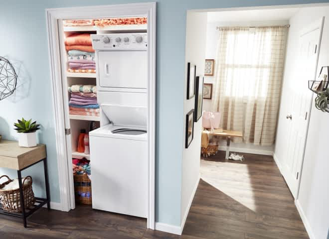 A Whirlpool® Stacked Laundry Center installed in a closet