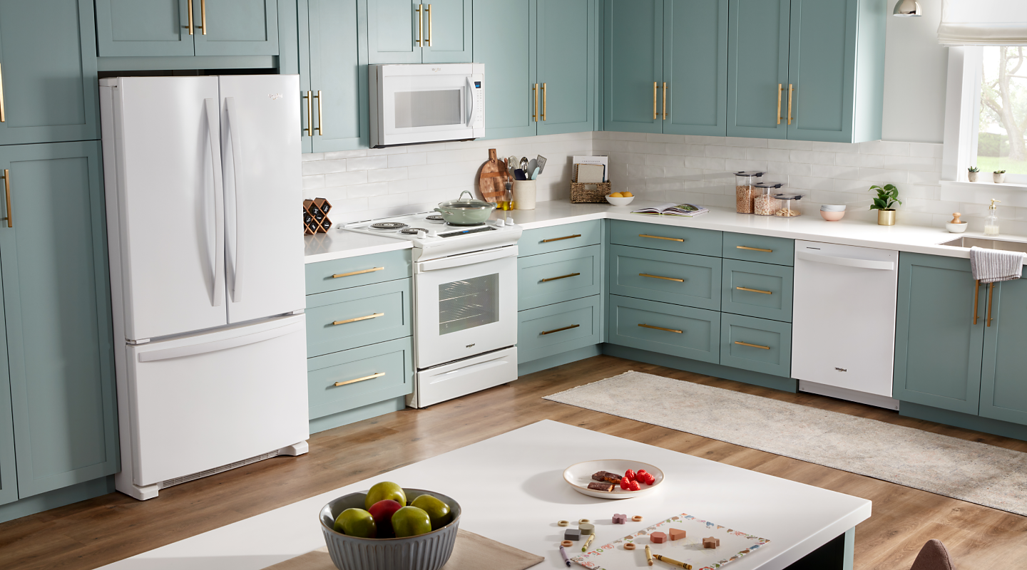  A Whirlpool® French Door Refrigerator with Bottom Freezer in a kitchen setting