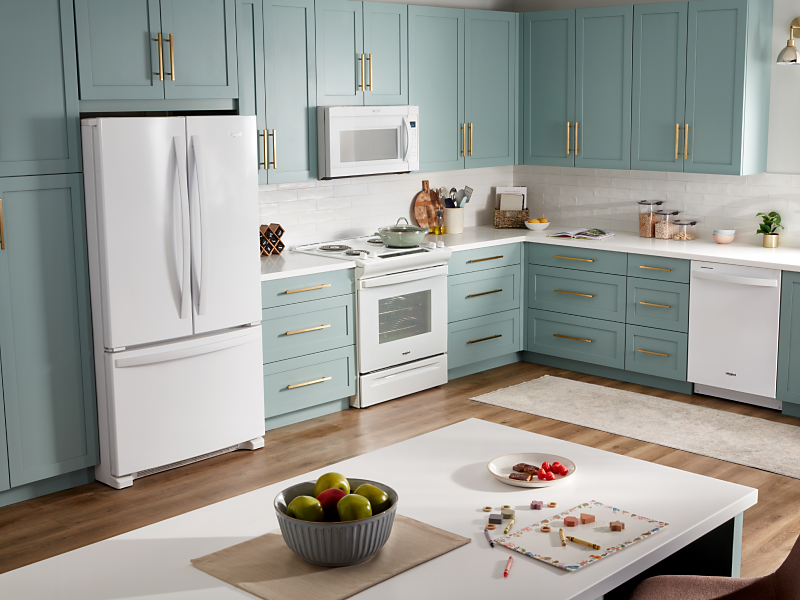  A Whirlpool® French Door Refrigerator with Bottom Freezer in a kitchen setting