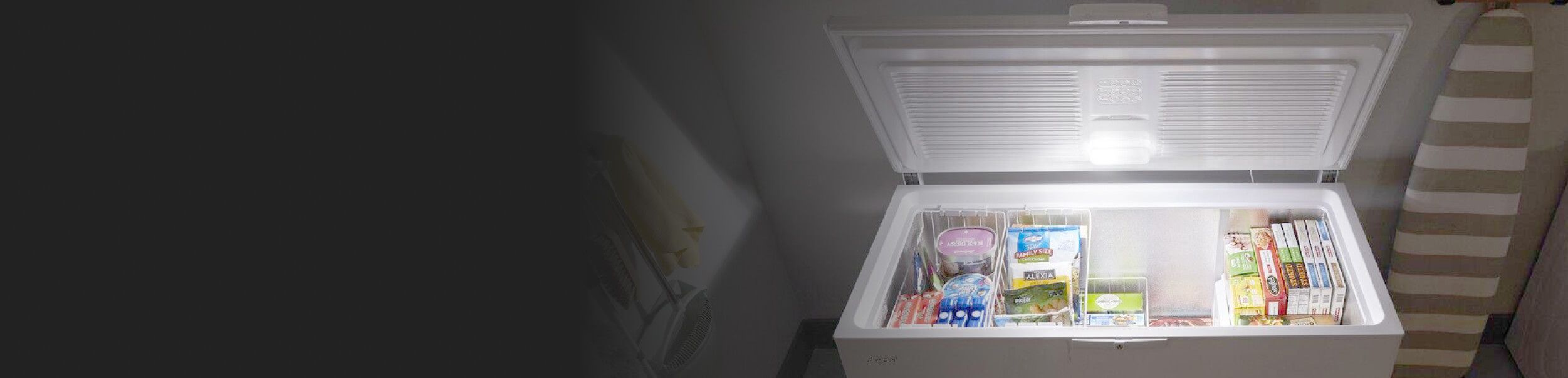 Open chest freezer loaded with frozen items