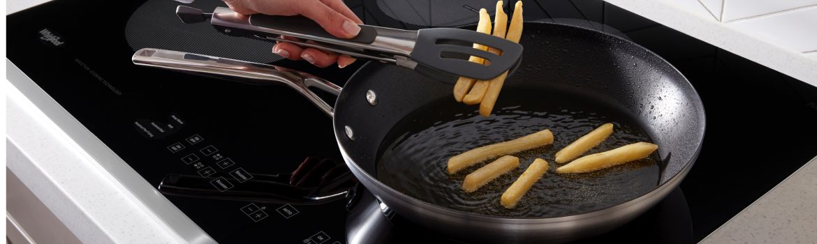 French fries being cooked on a Whirlpool® Electric Cooktop