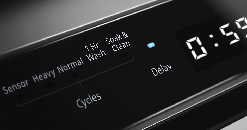 The black control panel on a stainless steel dishwasher. On display: options include &#34;Sensor&#34;, &#34;Heavy&#34;, &#34;Normal&#34;, &#34;1 Hr Wash&#34;, &#34;Soak & Clean&#34;. Underneath are the two options: &#34;Cycles&#34; and &#34;Delay&#34;. The time display reads, &#34;0:59&#34;