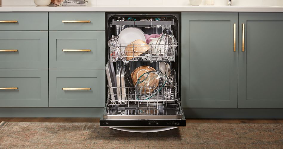 Whirlpool dishwasher loaded with several items