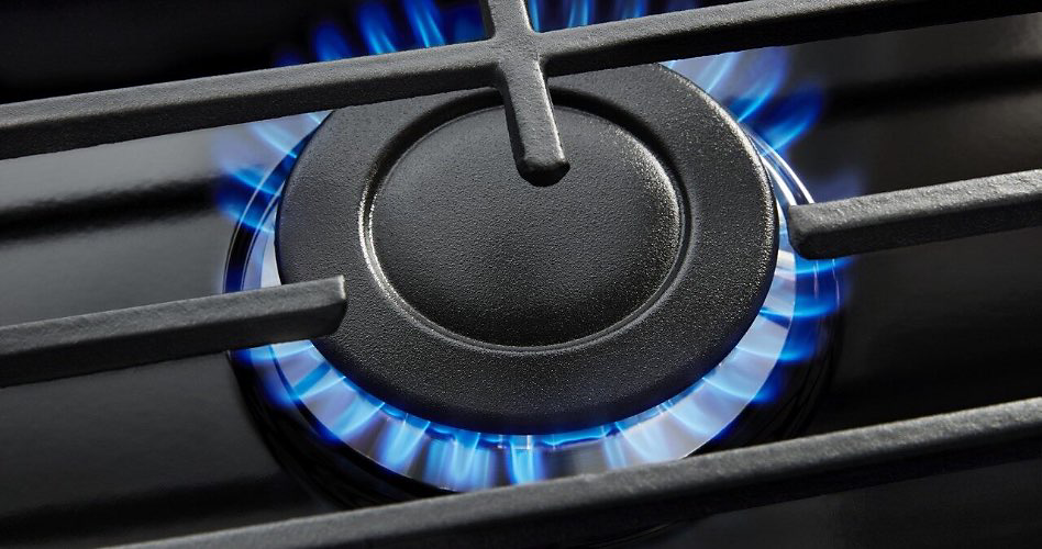 A gas burner with a blue flame.