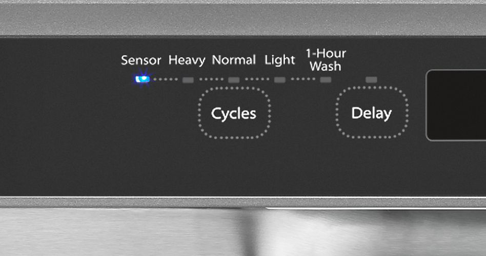 The control panel on a Whirlpool dishwasher. The sensor light is on. The other control are "Heavy", "Normal", "Light" and "1-Hour Wash". There are two buttons underneath: ""Cycles" and "Delays"