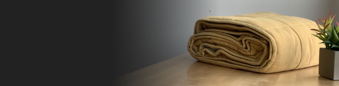 A folded blanket sits on a counter