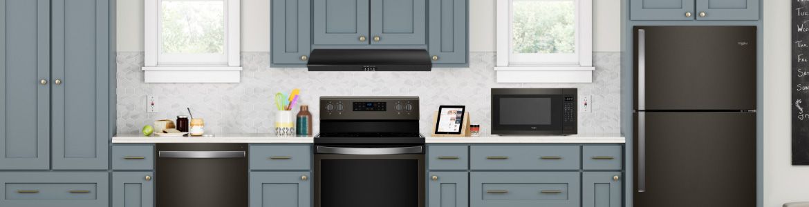 A kitchen featuring black stainless steel Whirlpool appliances