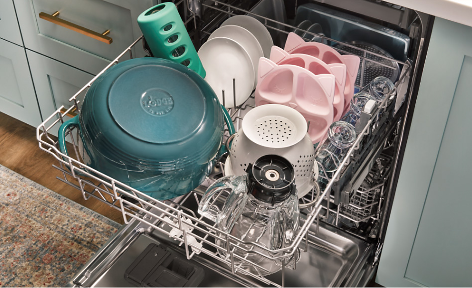 Various dishes in the top rack of a dishwasher