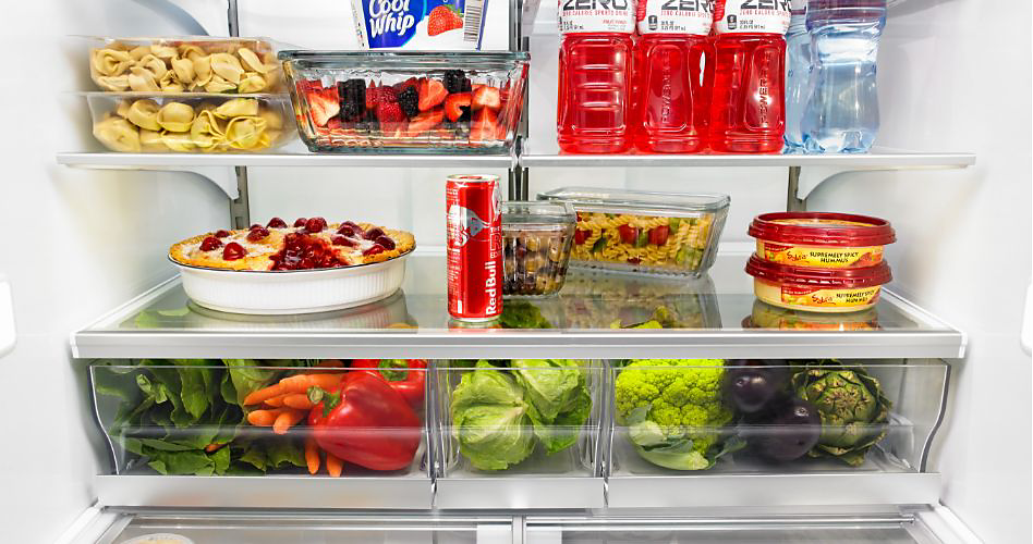 A refrigerator containing a variety of food items arranged on multiple shelves