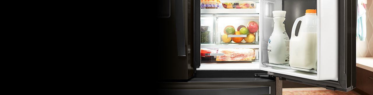 French door refrigerator with one door open showing food and drinks