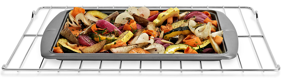 Roasted vegetables in pan on oven rack