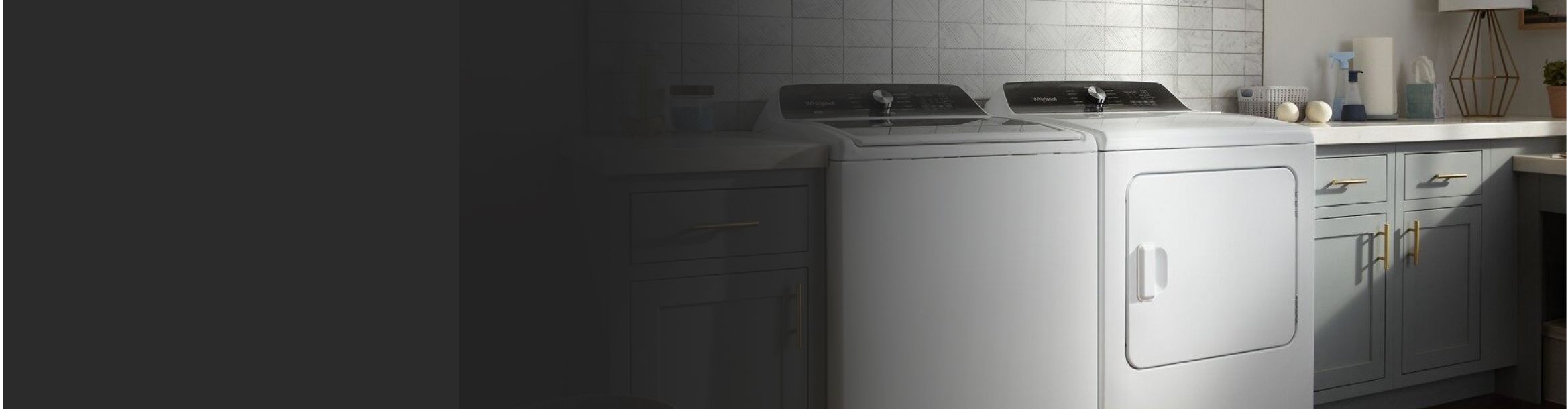A white washer and dryer pair in a laundry room