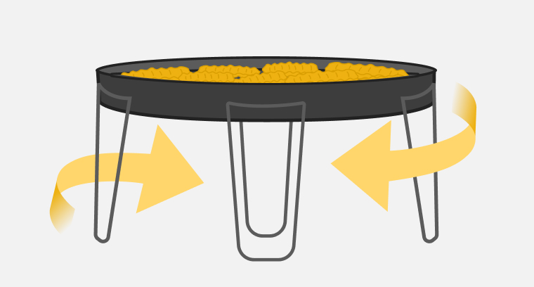 An Air Fry basket with fries and arrows indicating heat and air flow underneath