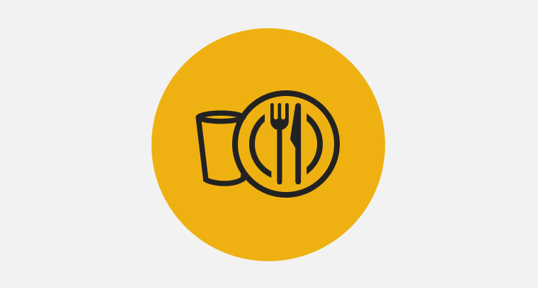 An icon representing a full place setting with plate, fork, knife and cup