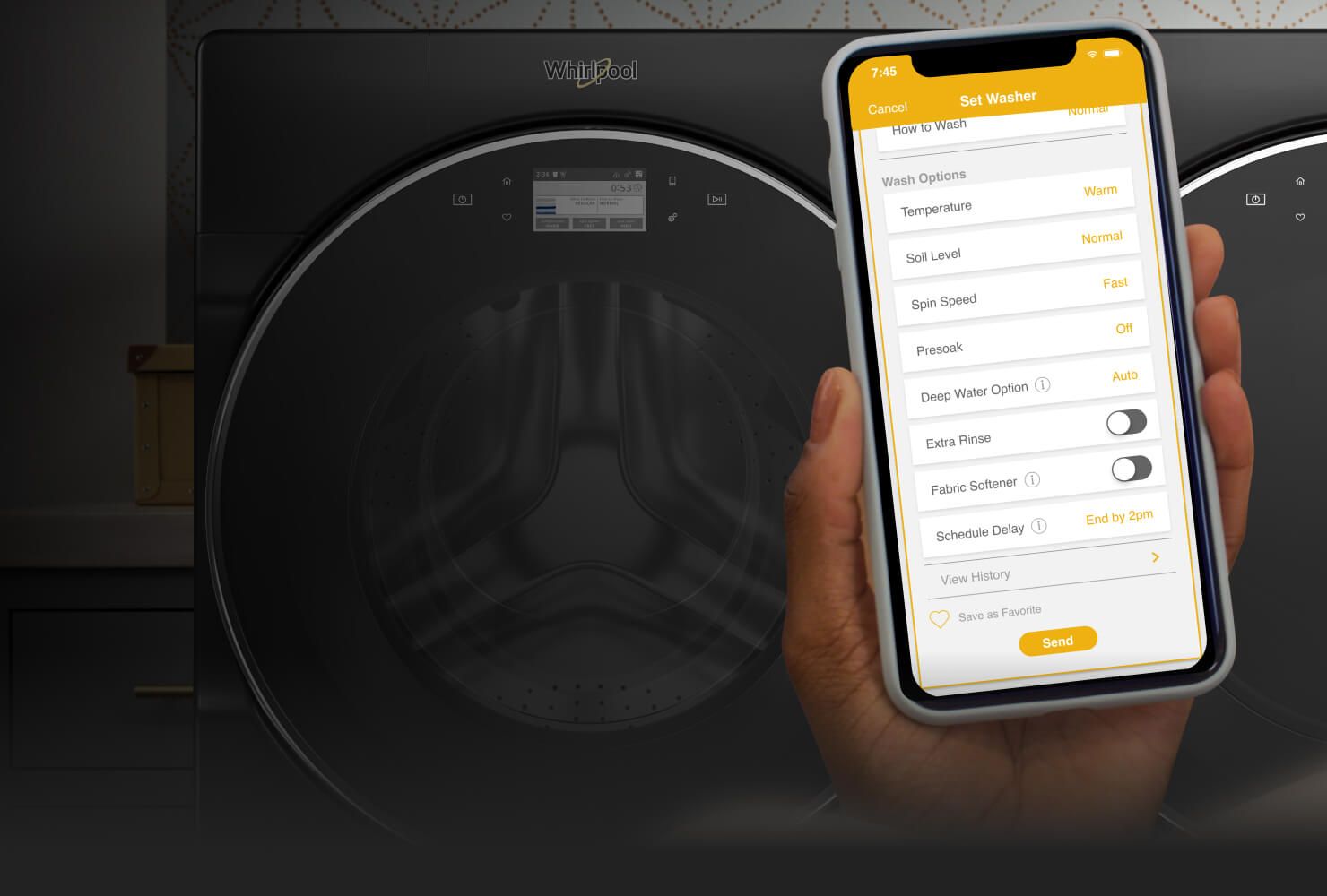 Smartphone with My Home screen in the Whirlpool® app in front of laundry pair