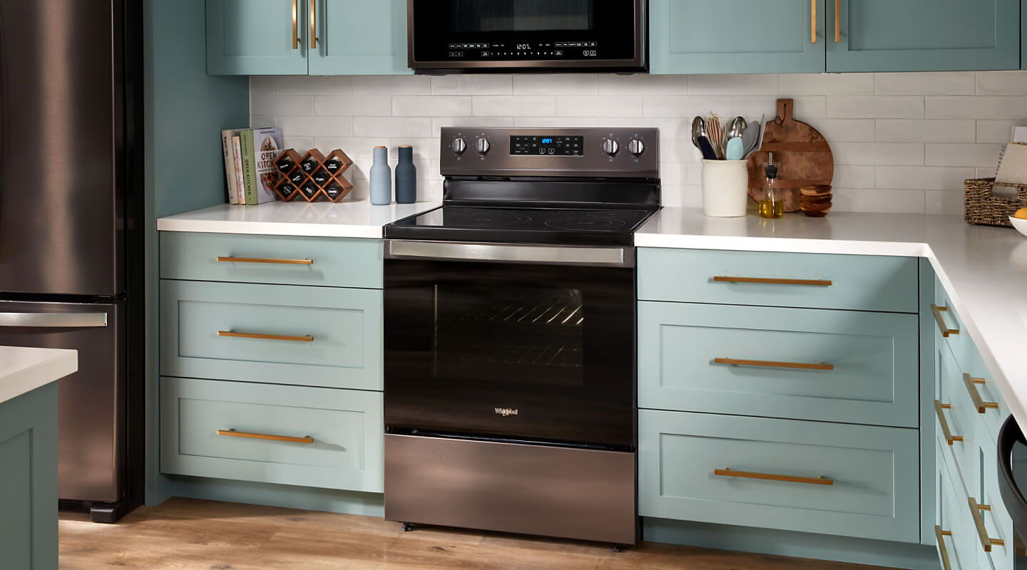 Whirlpool® electric range in blue cabinetry
