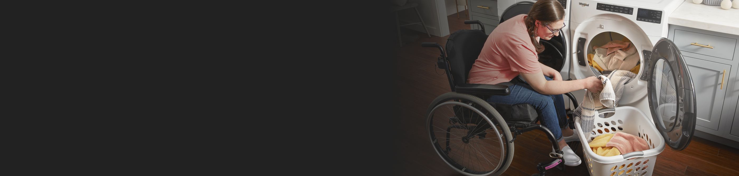 Person in a wheelchair using a Whirlpool® dryer