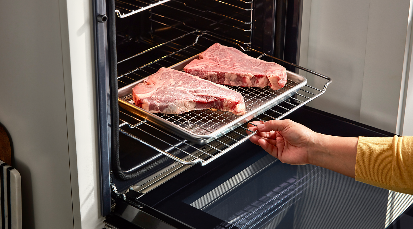 Steaks cooking in an oven