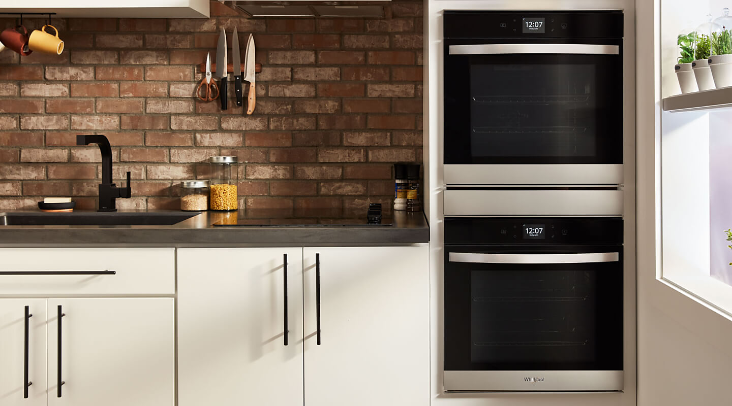 Whirlpool® double wall oven in a rustic kitchen