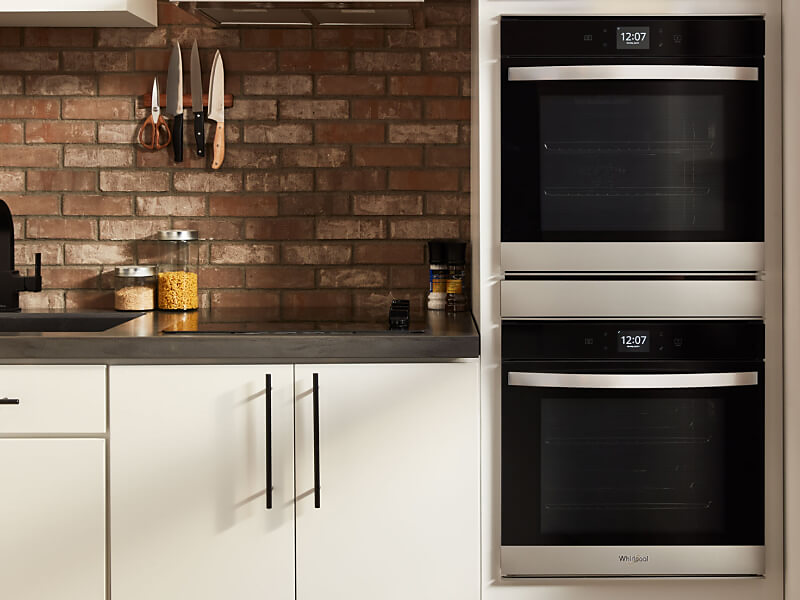 Whirlpool® double wall oven in a rustic kitchen