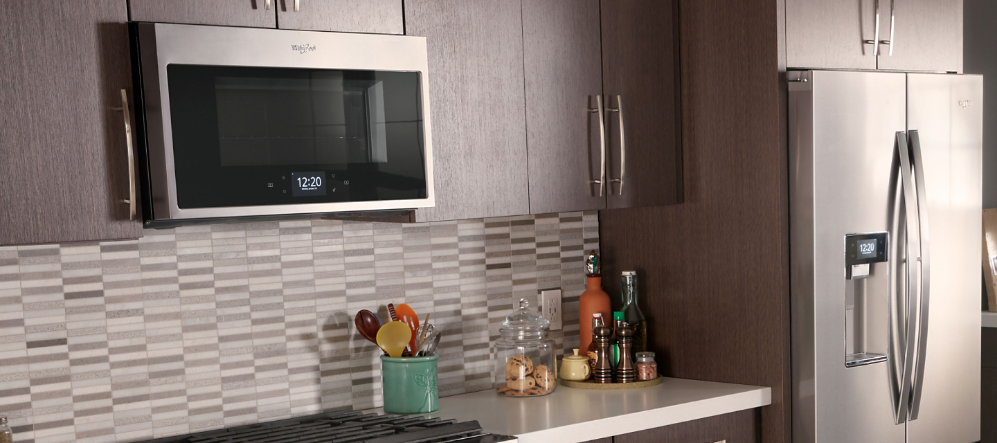 Whirlpool® Over-the-Range Convection Microwave in brown cabinetry
