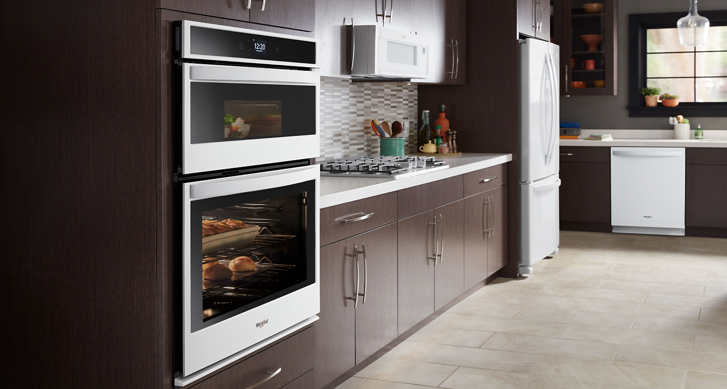 Whirlpool® Wall Oven and Microwave Combination in brown cabinetry