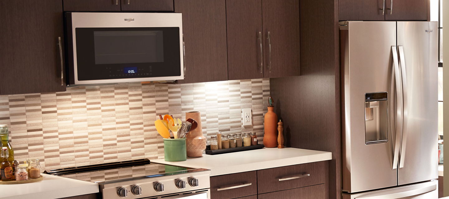 Whirlpool® Over-the-Range Smart Microwave in brown cabinetry