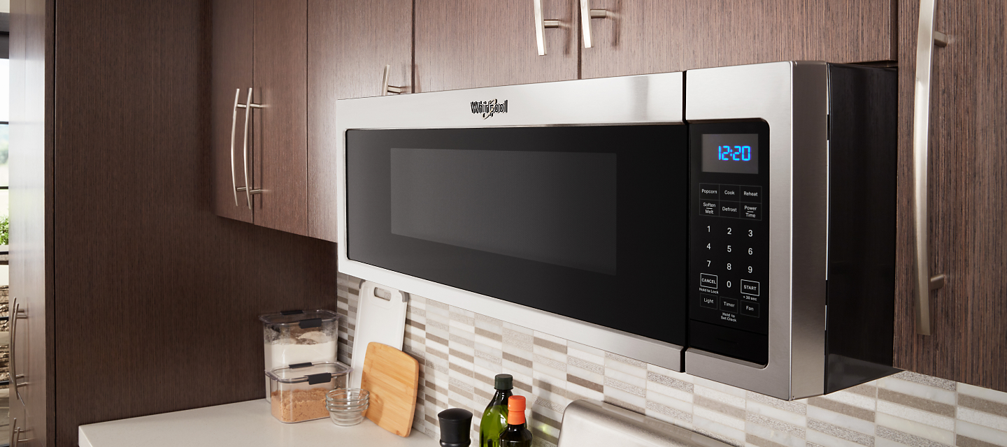 Whirlpool®  Low Profile Microwave in brown cabinetry