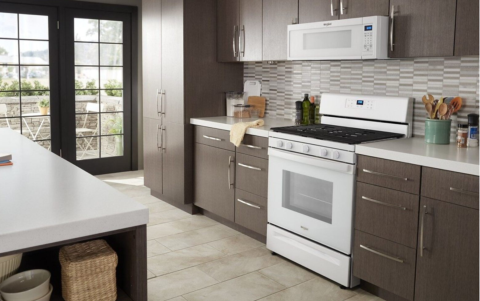 Kitchen featuring Whirlpool® range and microwave in white
