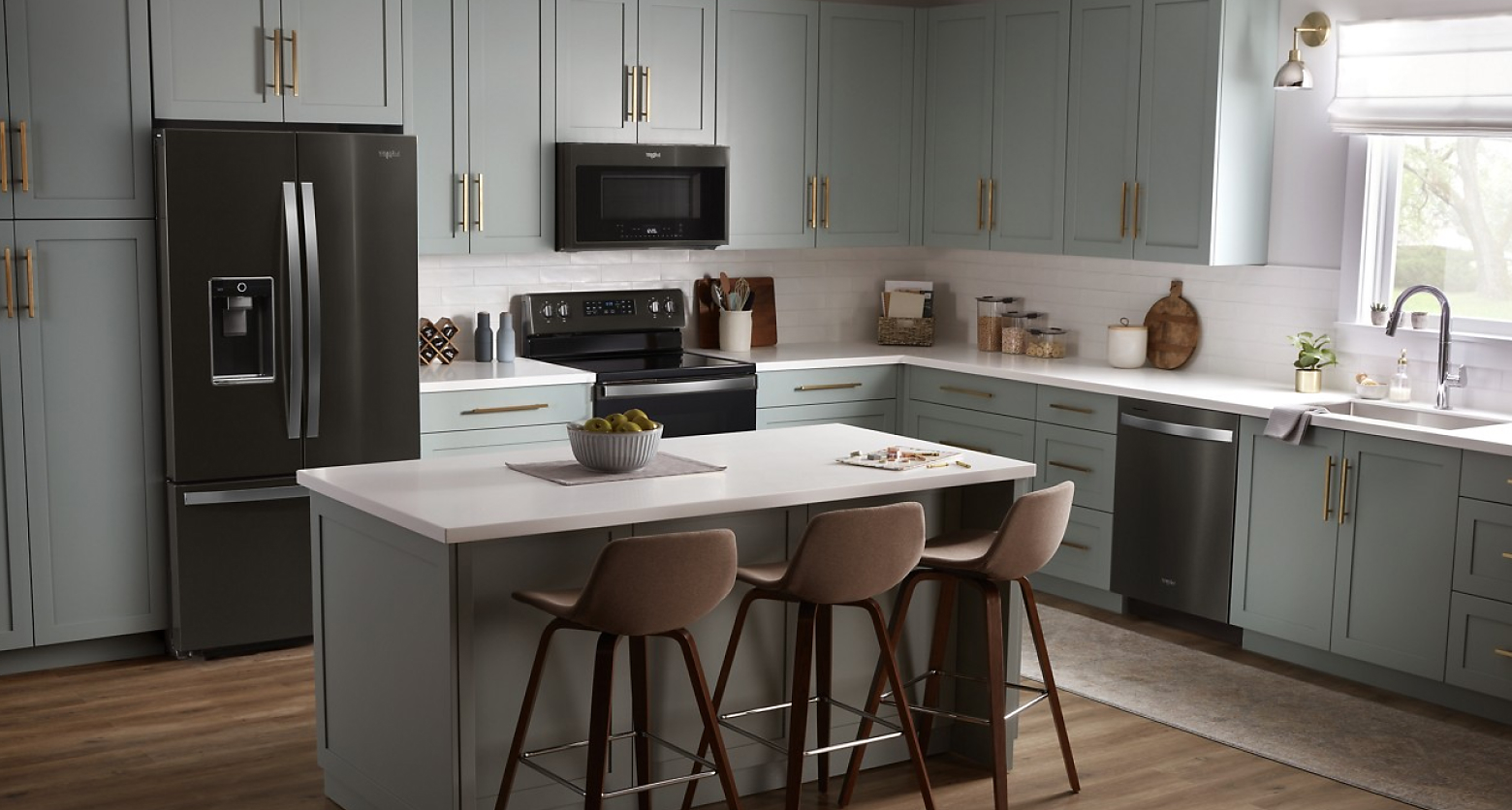 Gray kitchen featuring Whirlpool®  appliances in black stainless steel 