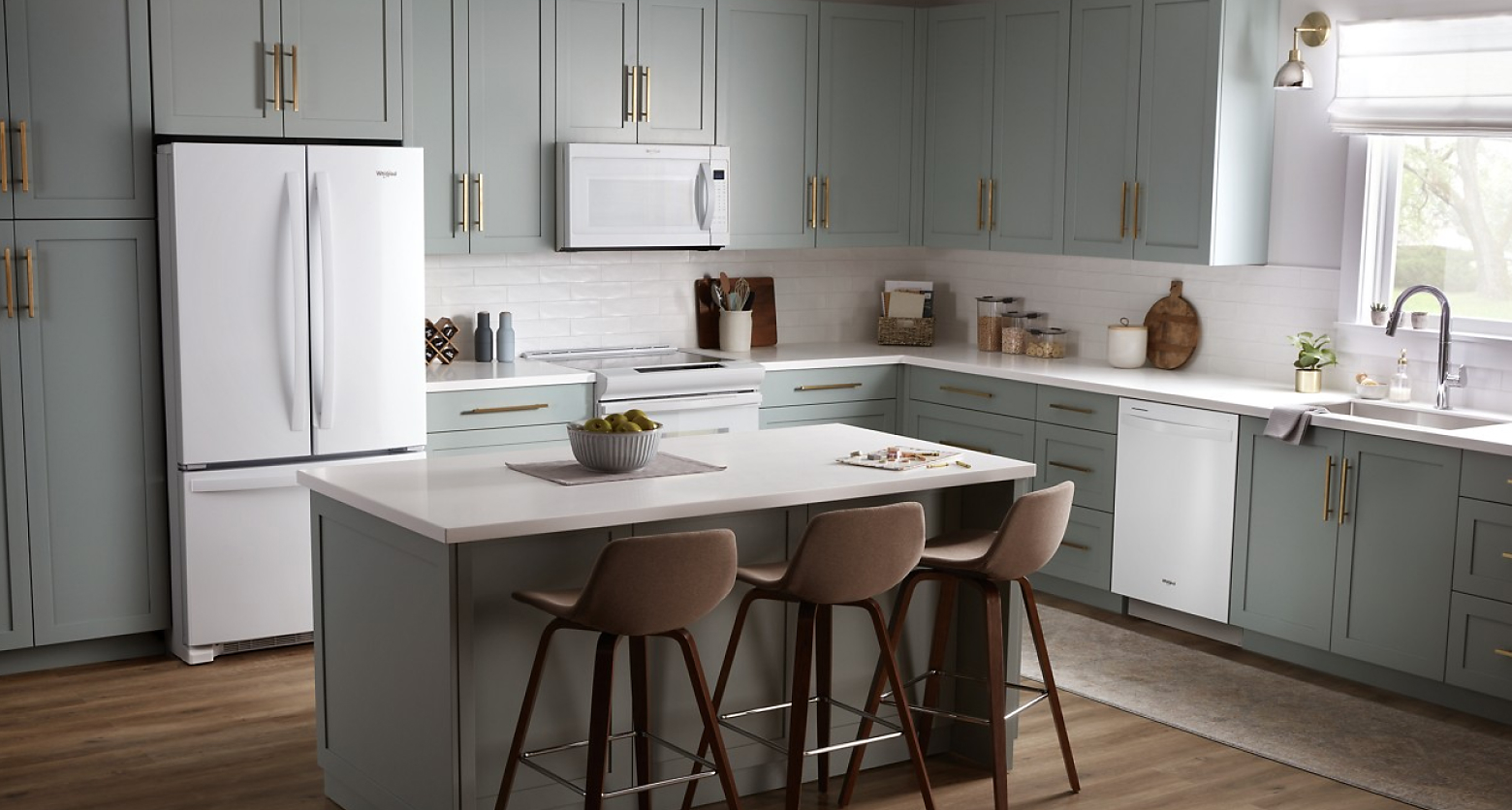 Gray kitchen featuring Whirlpool®  appliances in white
