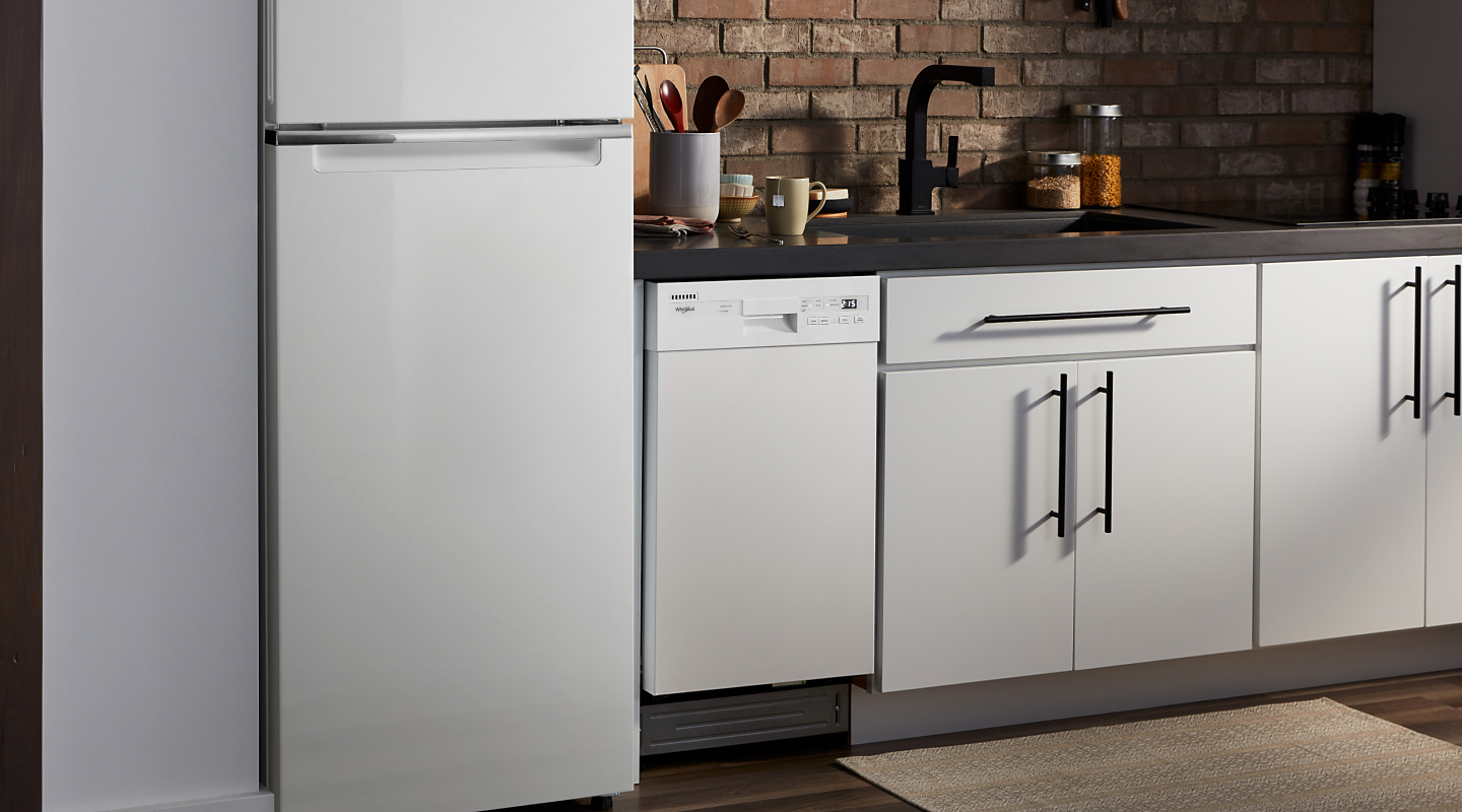 Whirlpool® refrigerator and dishwasher in a bright kitchen
