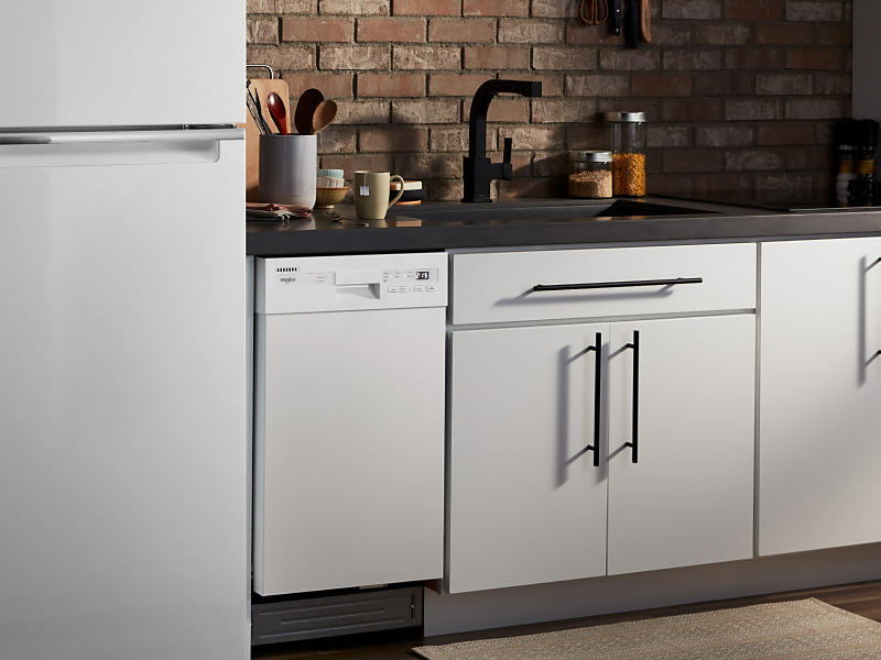 Whirlpool® refrigerator and dishwasher in a bright kitchen