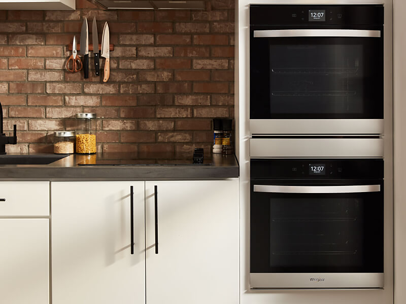 Whirlpool® stainless steel double wall oven in a contemporary kitchen